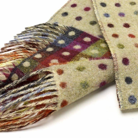 Colorful polka dot scarf with fringe on a white background