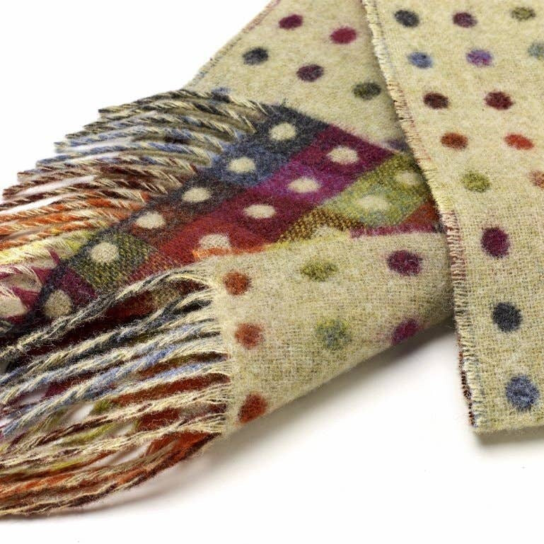 Colorful polka dot scarf with fringe on a white background